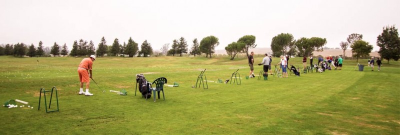 practicing-on-the-green-chip-in